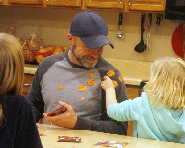 foster daughter places stickers on dad | coyotehill.org