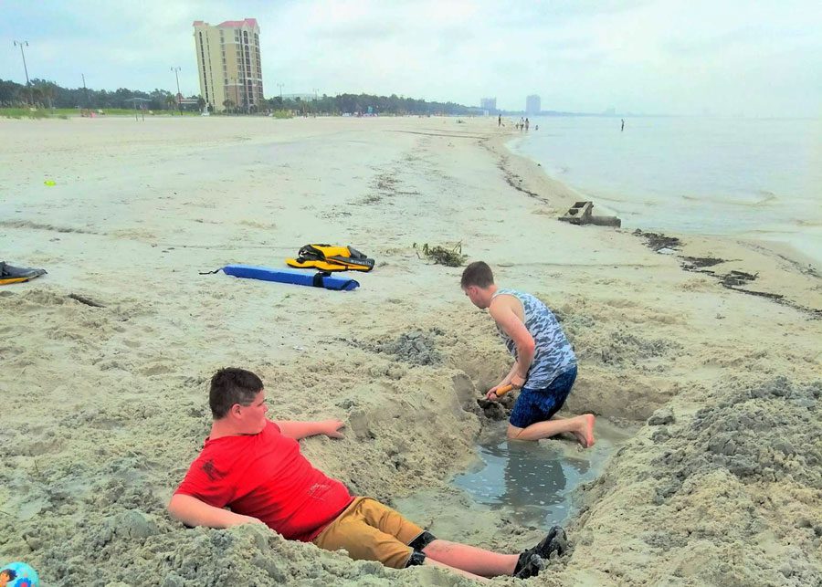 Boys enjoy being boys at the beach in Gulfport | coyotehill.org