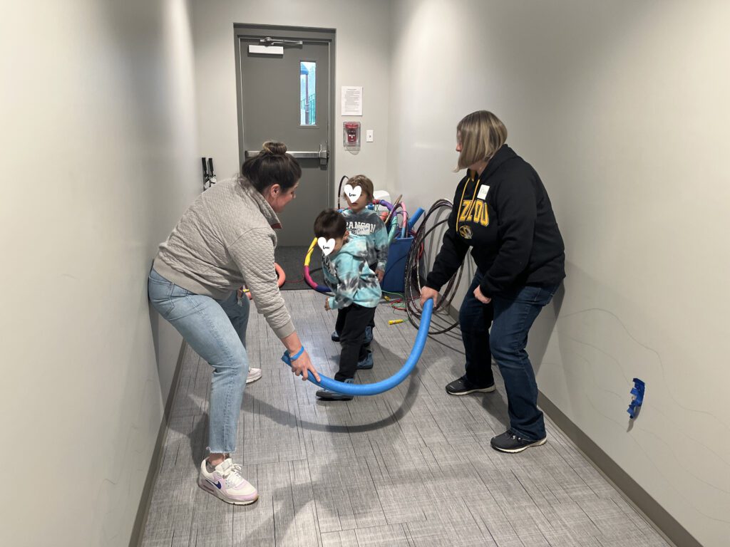 children play with volunteers at a Coyote Hill Foster Care Ministries respite event.